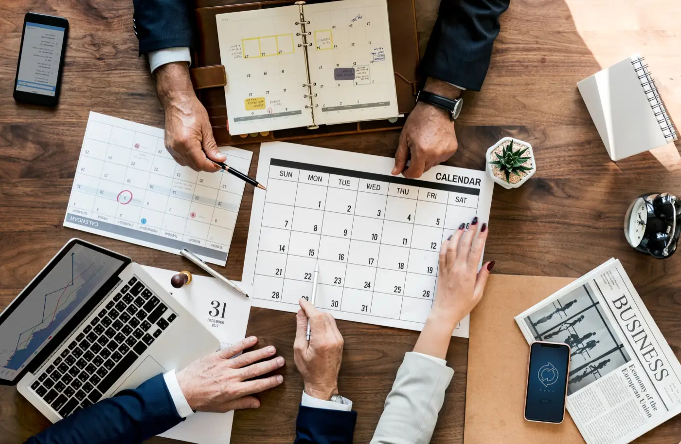 Event team planning dates around a calendar