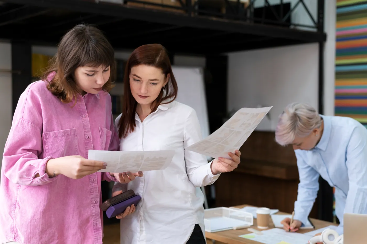 Event organizers reviewing plans together in an office